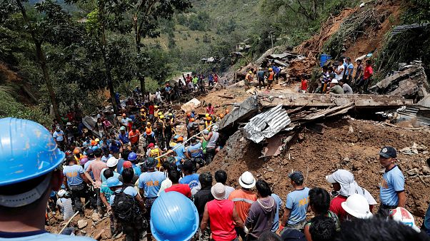 Rescuers in Itogon municipality, Philippines at the site of a landslide Rescuers in Itogon municipality, Philippines at the site of a landslide