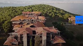 Watch: Locals push to save Europe's largest wooden building from ruins