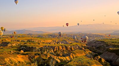 Tourists return to take flight in hot air balloons in Cappadocia, Turkey 