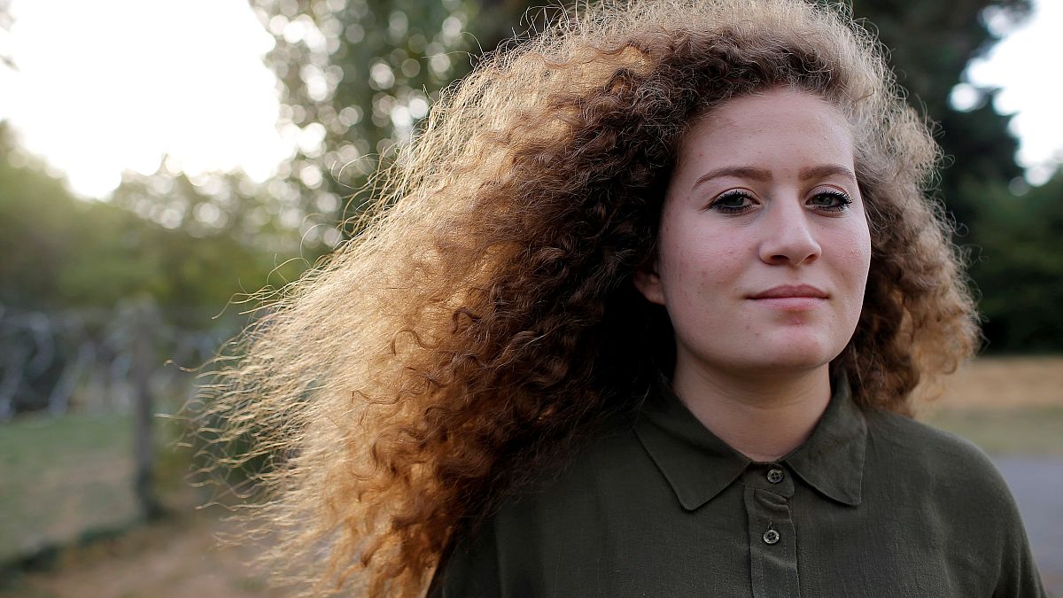 Ahed Tamimi poses for a picture before conference in Nantes France
