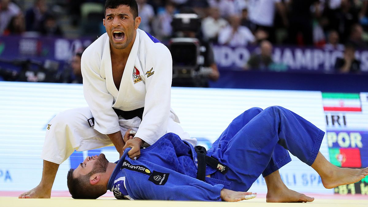 Saeid Mollaei of Iran in action against Anri Egutidze (blue) of Portugal