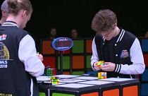 Watch: Speedy fingers compete in Rubik's Cube championship