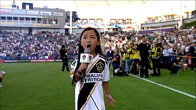 A pint-sized vocal powerhouse stuns the crowd at a MLS game