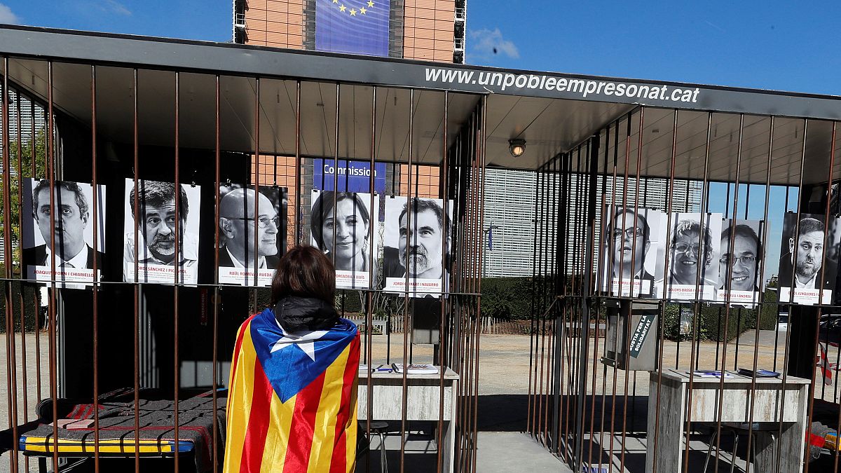 Retratos de los líderes catalanes ante la CE en Bruselas