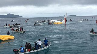 People are evacuated from an Air Niugini plane crashed in Micronesia
