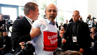 Watch: Protester ushered out of Erdogan-Merkel press conference