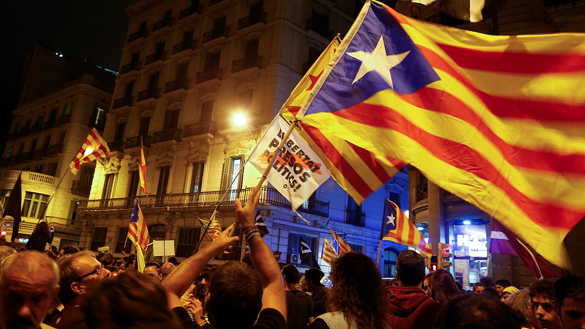 Tensions rise as large protests mark Catalonia referendum anniversary