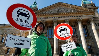 Greenpeace environmental activists protest in front of Leipzig court