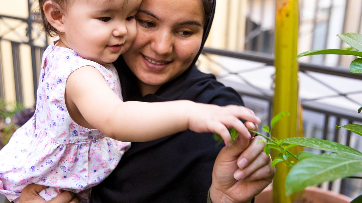 Soraya, 24, from Afghanistan with her daughter