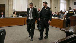 Chicago police Officer Jason Van Dyke is lead away after his guilty verdict