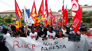 Migrants demonstrate in Riace to support mayor Lucano on October 6, 2018.
