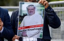A demonstrator holds picture of Saudi journalist Jamal Khashoggi