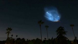 Falcon 9 launches over night sky