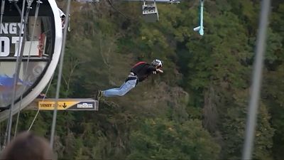 Dozens leap off bridge in Sochi annual base jump festival