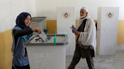 Afghans defy Taliban threats and vote in parliamentary elections
