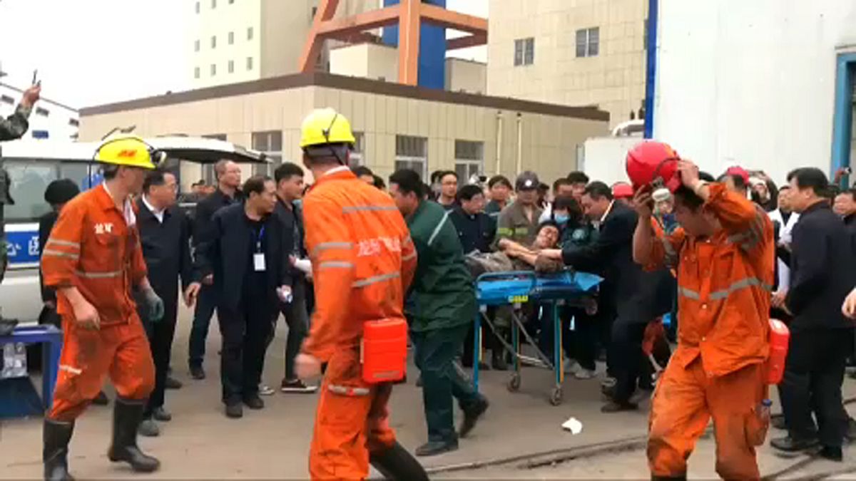 Two dead, 18 trapped in mine collapse in China