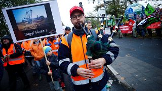Employees of German utility RWE attend a labour protest, as environmentalis