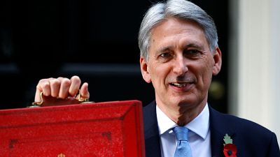 The UK Chancellor stands outside 11 Downing Street