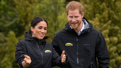 Harry and Meghan partake in NZ welly wanging competition