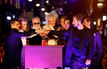 Queen's Brian May and Roger Taylor with the cast of Bohemian Rhapsody.