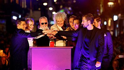 Queen's Brian May and Roger Taylor with the cast of Bohemian Rhapsody.