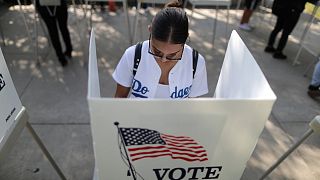 A voter makes her choice in the US midterm elections.