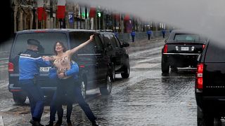 Topless protester gets within metres of Trump's motorcade in Paris