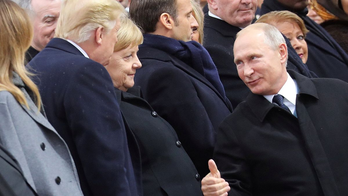 Watch: Putin's warm thumbs-up to Trump at Paris commemorations