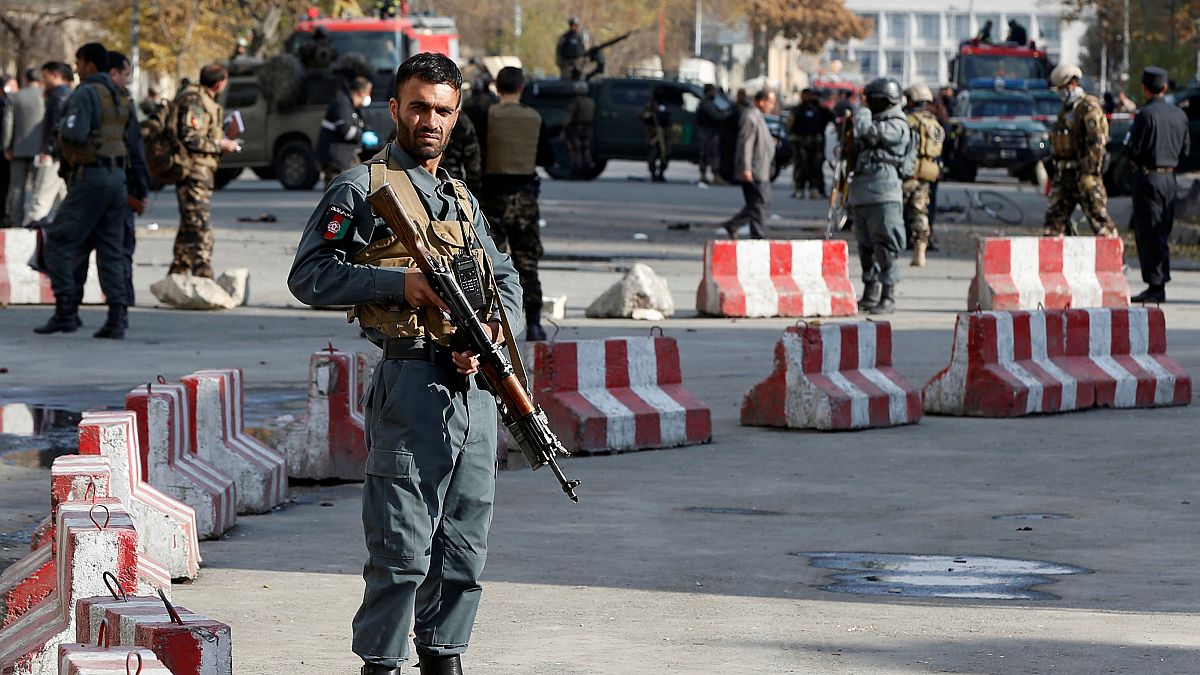 Afghan policemen at site of a previous blast in Kabul, November 12, 2018