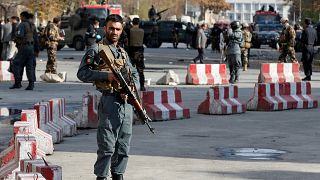 Afghan policemen at site of a previous blast in Kabul, November 12, 2018