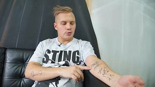 Watch: Russian rock music fan auctions skin tattooed with autographs