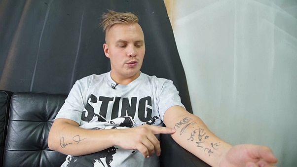 Watch: Russian rock music fan auctions skin tattooed with autographs Watch: Russian rock music fan auctions skin tattooed with autographs