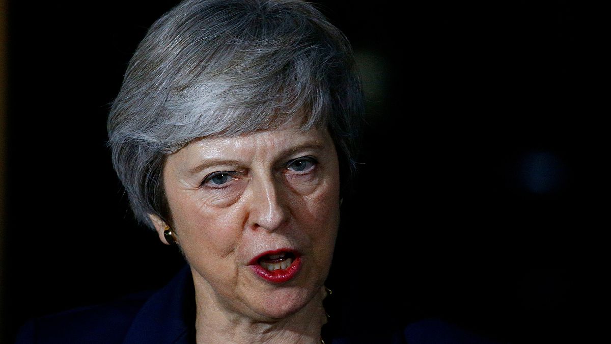 May survives first Brexit hurdle as Brussels publishes draft deal