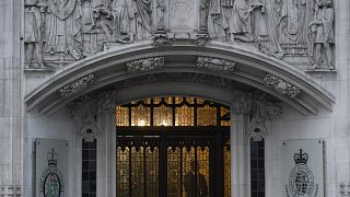 A member of security stands guard inside the Supreme Court in London