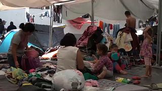 Migrants camped out in Mexico attend job fair 