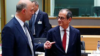 O comissário europeu Pierre Moscovici com o ministro Giovanni Tria