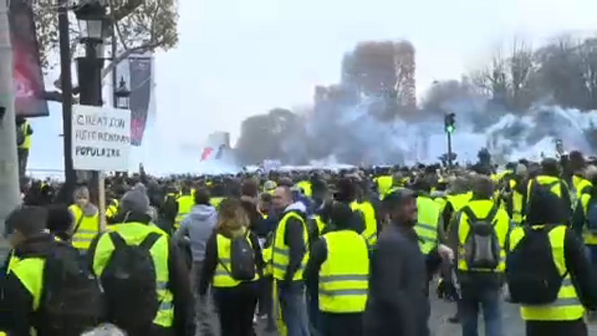 Police fire tear gas at yellow vest protesters in Paris