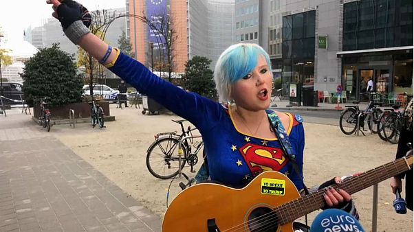 EU Supergirl sings 'anti-Brexit' song outside Brussels summit EU Supergirl sings 'anti-Brexit' song outside Brussels summit