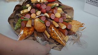 Forget flowers, Russians tuck into food bouquets