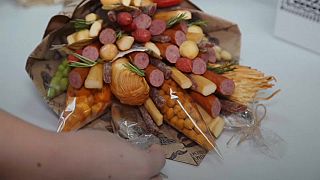 Forget flowers, Russians tuck into food bouquets 