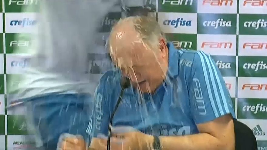 Luiz Felipe Scolari soaked by Palmeiras squad after title win