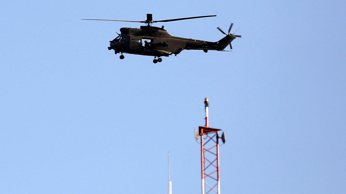 File: NATO helicopter flies over Resolute Support headquarters in Kabul.