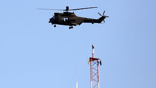 File: NATO helicopter flies over Resolute Support headquarters in Kabul.