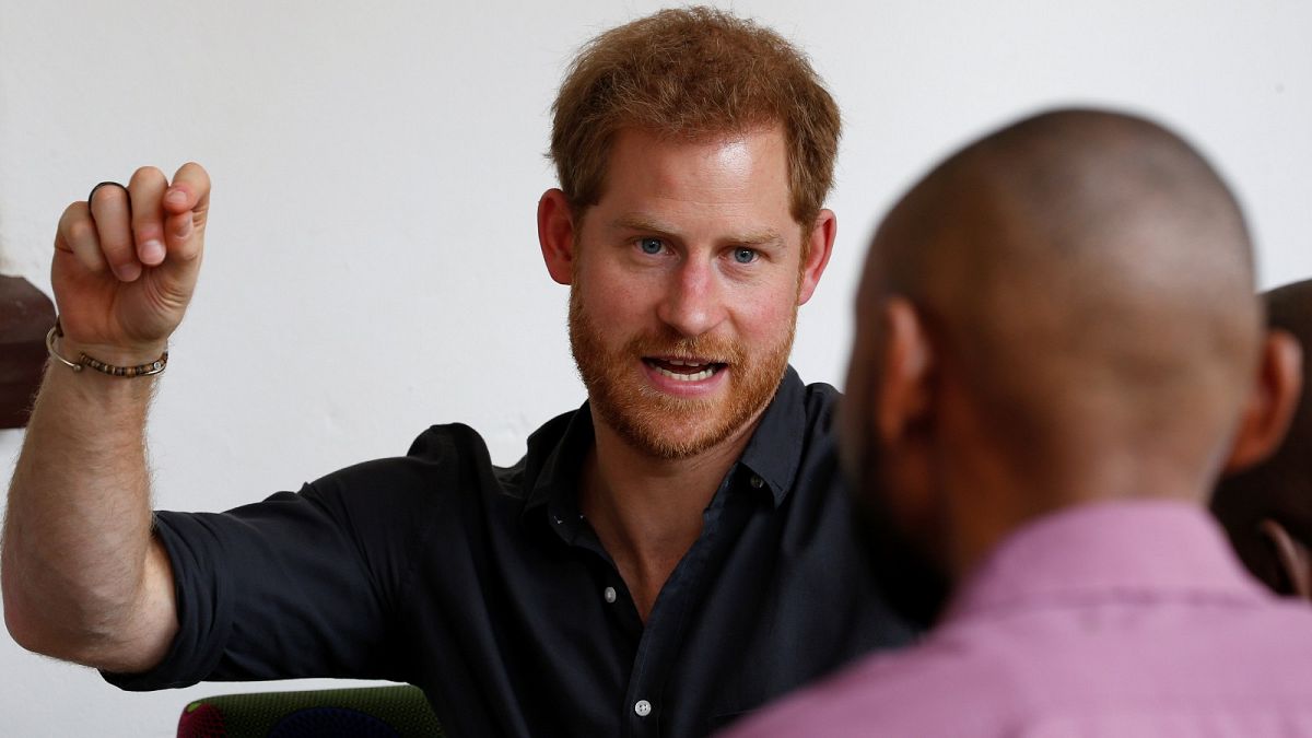 Prince Harry speaks to youths during a visit to BongoHive in Lusaka