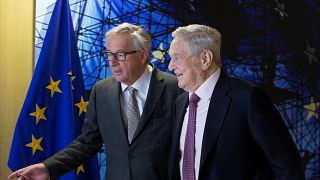 File photo of George Soros and Jean-Claude Juncker