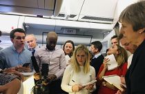Theresa May speaks to journalists on her plane