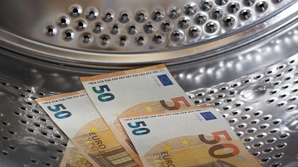 Money laundering - washing money in a washing machine Money laundering - washing money in a washing machine