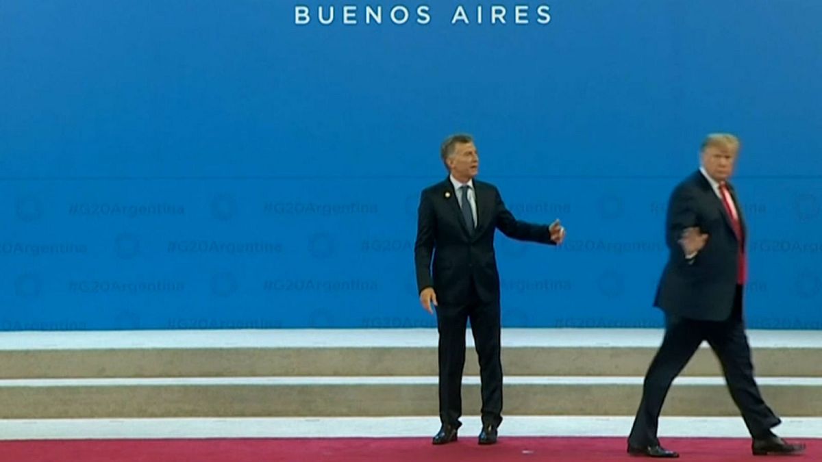 Watch: Argentine president left standing awkwardly after Trump wanders off 