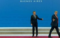 Watch: Argentine president left standing awkwardly after Trump wanders off 