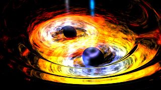 Zwei schwarze Löcher nähern sich einander (Weltraumteleskop WISE)